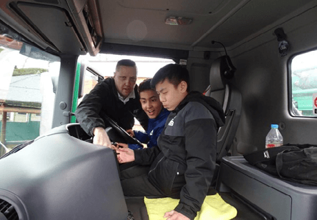 Two kids sat in a lorry