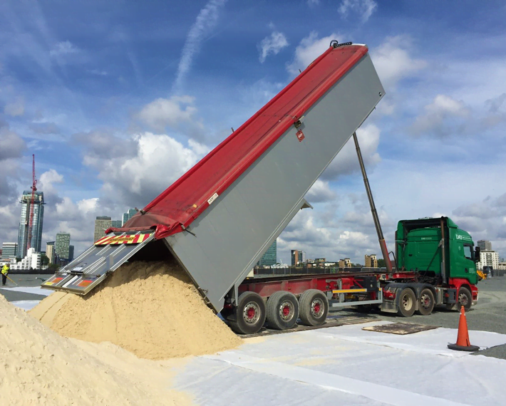 Artic lorry tipping out sand