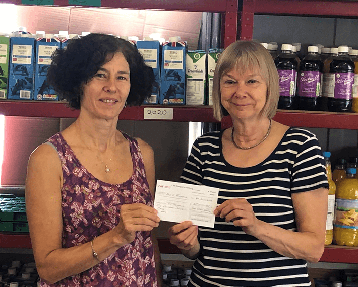 two ladies with a certificate