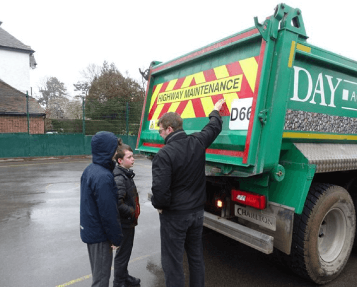 two kids being shown round a lorry