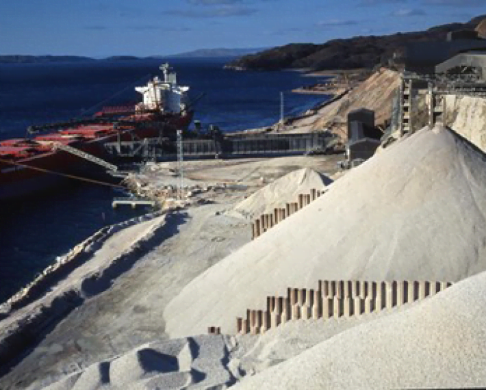 a quarry with piles of materials
