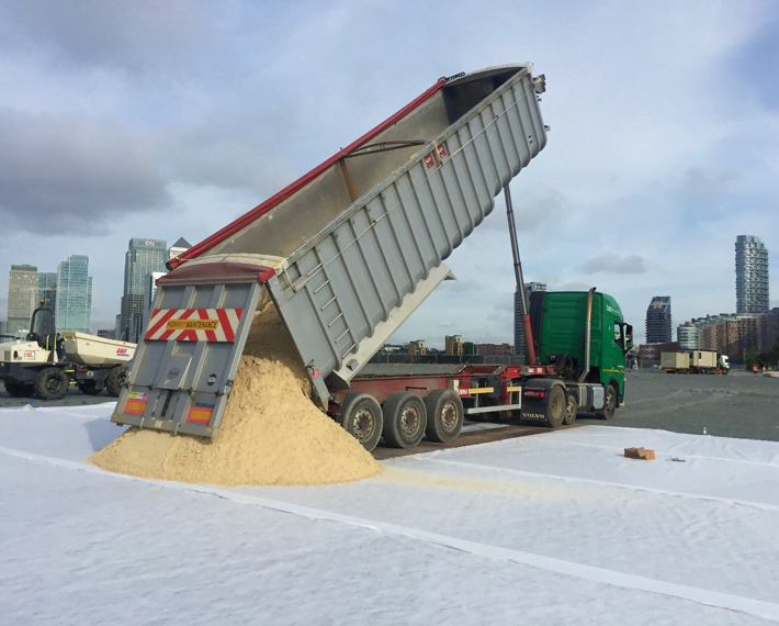 Artic lorry tipping out sand