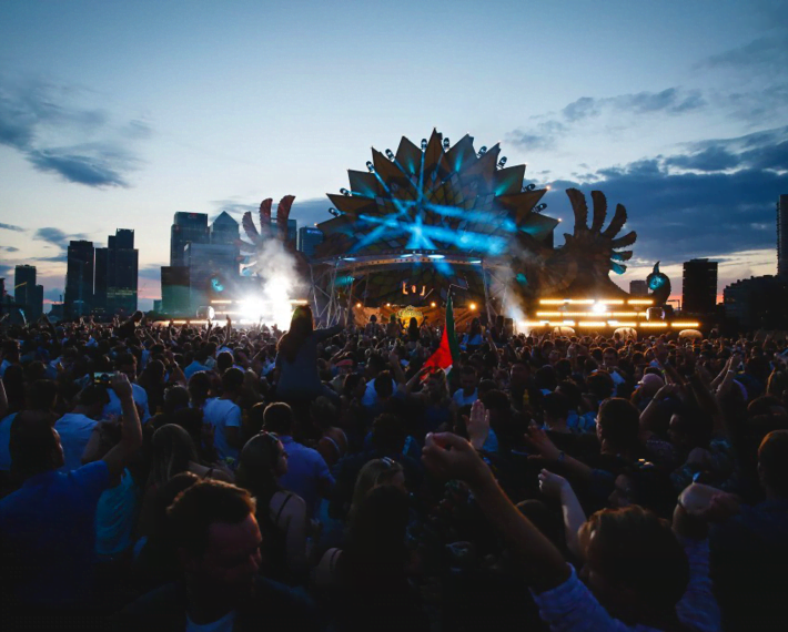 festival main stage with sunset in background