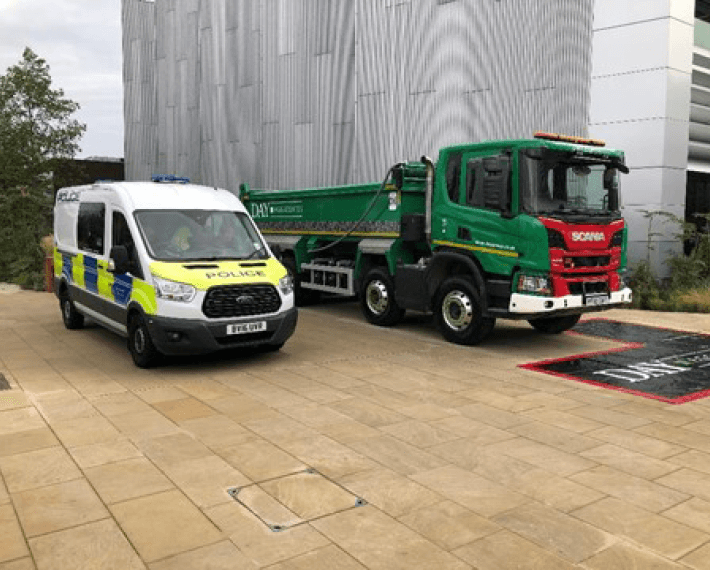 Police van and Day aggregates Lorry side by side