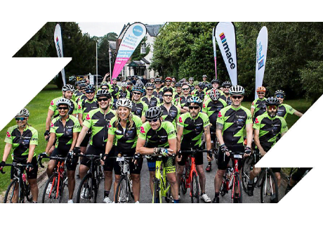 big group of cyclists starting a charity ride